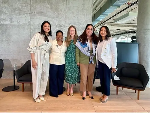 Five women leaders on stage after an Expedia Group panel