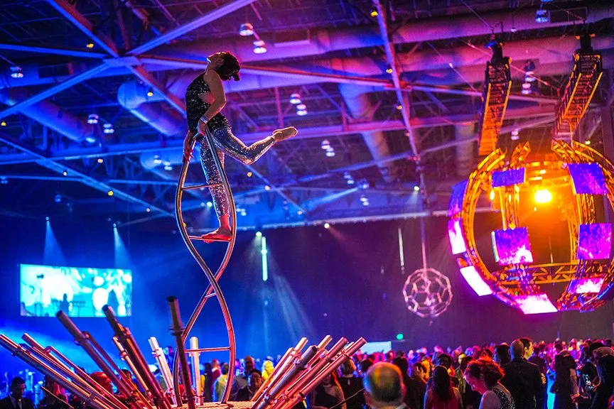 An aerial performer above the crowd at an Expedia Group gala